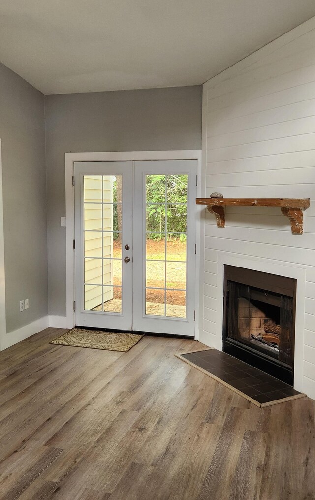 entryway with hardwood / wood-style floors and french doors