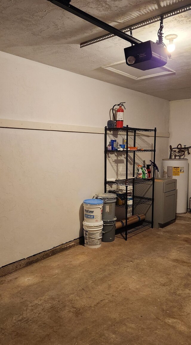 garage with a garage door opener and water heater