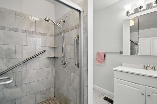 1118 W Green St, Perry, FL 32347 - full bathroom featuring a stall shower, vanity, tile patterned flooring, and baseboards
