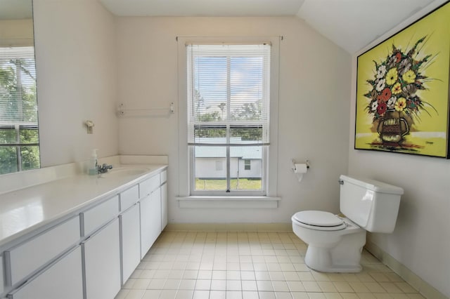 1118 W Green St, Perry, FL 32347 - bathroom featuring vanity, toilet, baseboards, and lofted ceiling