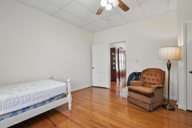 1118 W Green St, Perry, FL 32347 - bedroom featuring a drop ceiling, light wood-style floors, and baseboards