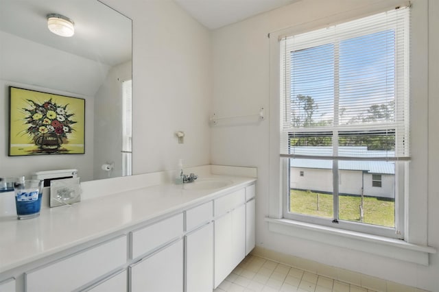 1118 W Green St, Perry, FL 32347 - bathroom with vanity, tile patterned floors, and baseboards