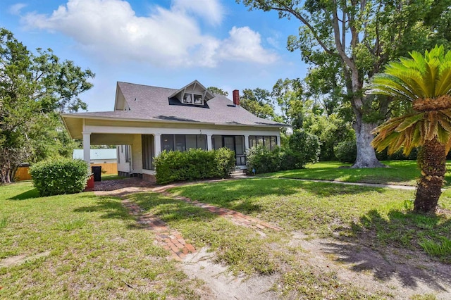 1118 W Green St, Perry, FL 32347 - view of front of house with a chimney, a front lawn, and roof with shingles