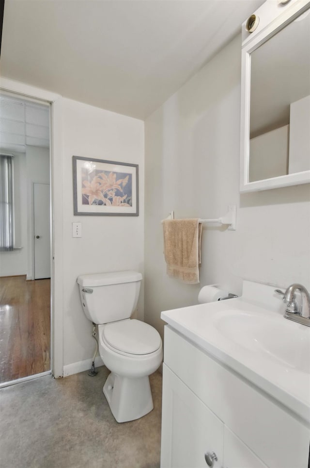 1118 W Green St, Perry, FL 32347 - half bath featuring vanity, toilet, and baseboards