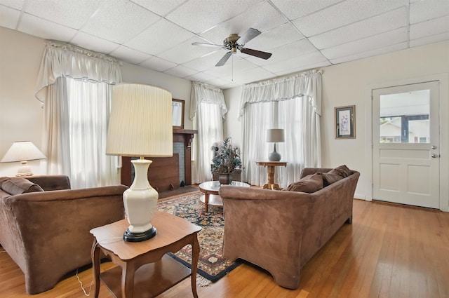 1118 W Green St, Perry, FL 32347 - living room featuring a paneled ceiling, hardwood / wood-style floors, and a ceiling fan