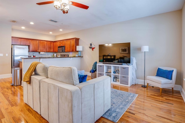 415 Saint Francis St Unit 133, Tallahassee, FL 32301 - living room featuring ceiling fan, light wood-style flooring, baseboards, and recessed lighting