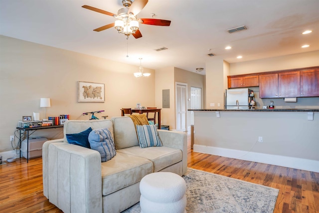 415 Saint Francis St Unit 133, Tallahassee, FL 32301 - living area with wood finished floors, a ceiling fan, recessed lighting, and baseboards