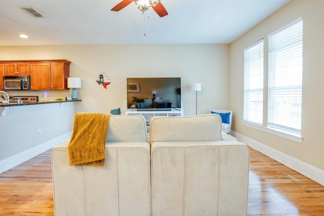415 Saint Francis St Unit 133, Tallahassee, FL 32301 - living area featuring healthy amount of natural light, ceiling fan, light wood-style flooring, baseboards, and recessed lighting