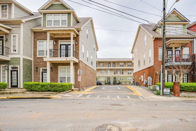 415 Saint Francis St Unit 133, Tallahassee, FL 32301 - view of asphalt street featuring sidewalks, curbs, and traffic signs