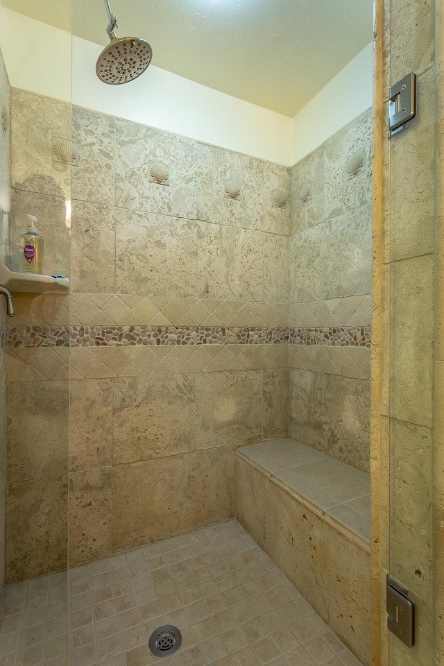 bathroom with tiled shower