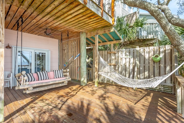 wooden deck featuring ceiling fan