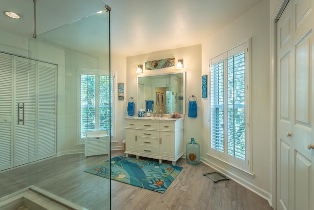 bathroom with vanity, a wealth of natural light, and toilet