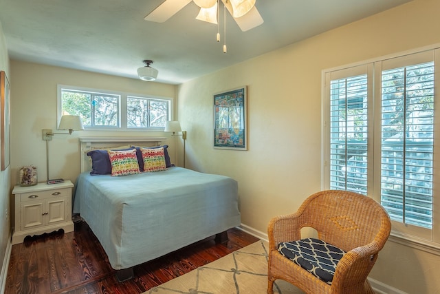 bedroom featuring dark wood-type flooring and ceiling fan