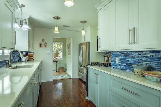 kitchen with sink, decorative light fixtures, stainless steel fridge, dark hardwood / wood-style floors, and backsplash