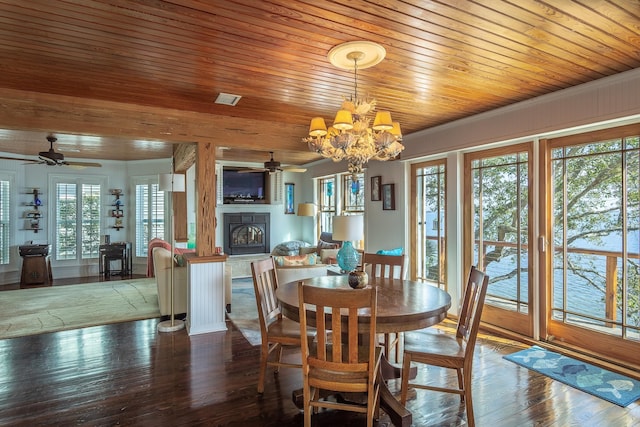 dining room featuring crown molding, hardwood / wood-style floors, ceiling fan with notable chandelier, and wooden ceiling