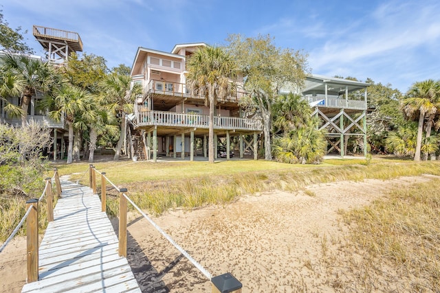 back of house featuring a balcony