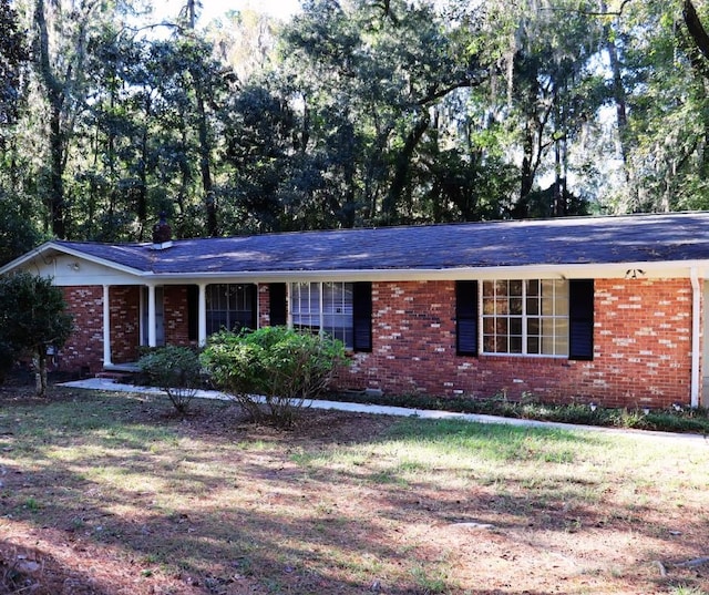 ranch-style house with a front yard