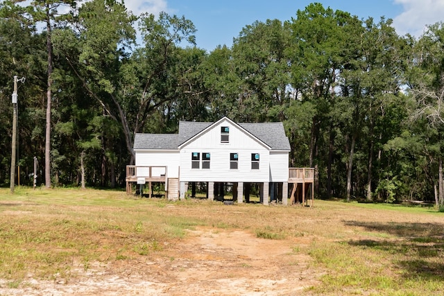 back of house with a wooden deck