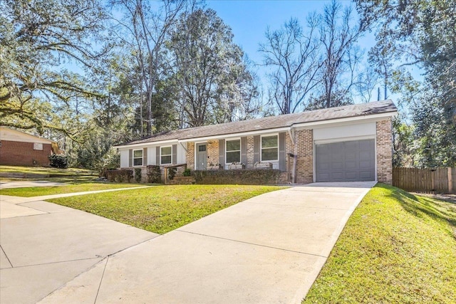 ranch-style home with driveway, a front lawn, fence, an attached garage, and brick siding