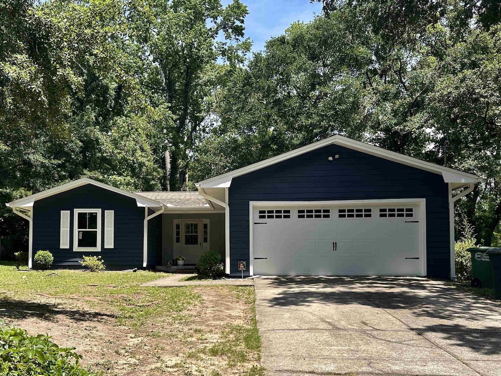 1937 Raymond Tucker Rd, Tallahassee, FL 32311 - ranch-style home with concrete driveway and an attached garage