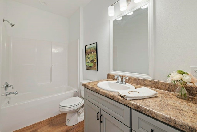 5698 Pinebarren Rd, Tallahassee, FL 32303 - full bath featuring toilet, vanity, wood finished floors, and bathing tub / shower combination