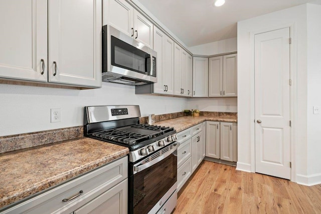 5698 Pinebarren Rd, Tallahassee, FL 32303 - kitchen featuring appliances with stainless steel finishes, light wood finished floors, and recessed lighting