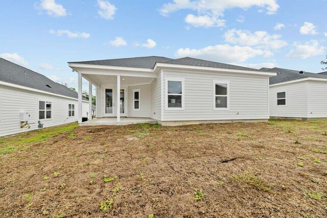 5698 Pinebarren Rd, Tallahassee, FL 32303 - rear view of property with a patio area and a yard