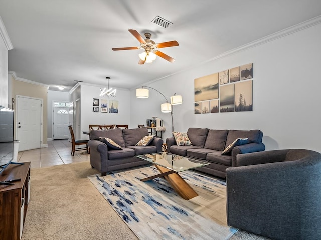 tiled living room with crown molding and ceiling fan