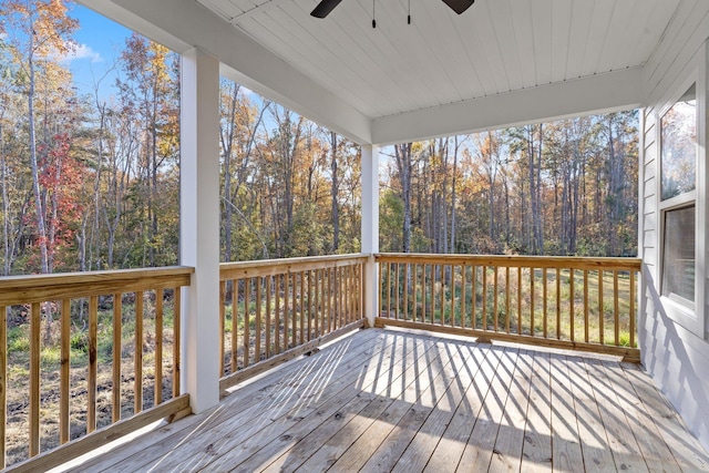 wooden terrace featuring ceiling fan