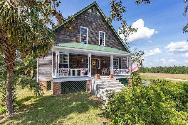 view of front facade featuring a porch and a front lawn