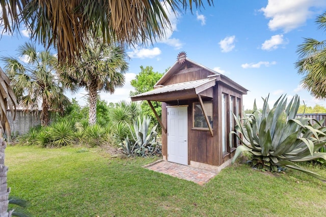 view of shed with fence