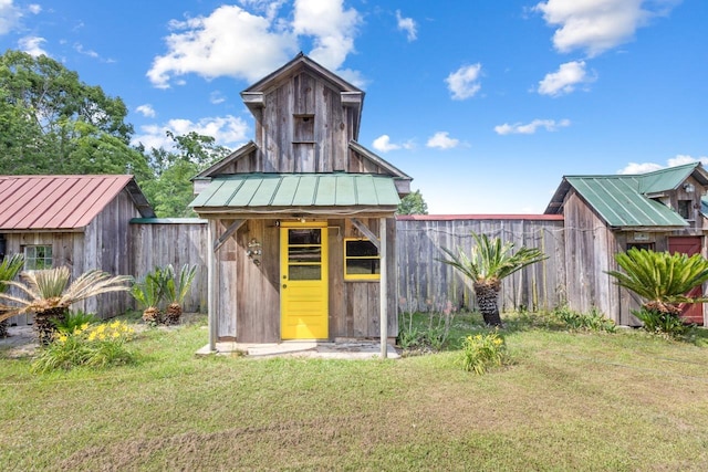 view of shed with fence