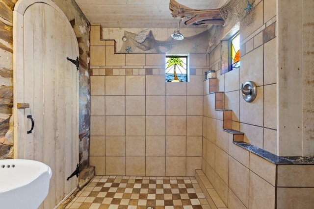 bathroom with a tile shower
