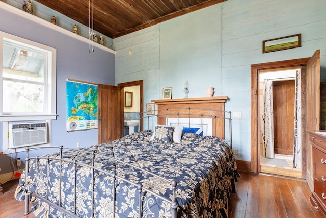 bedroom featuring a high ceiling, cooling unit, wood walls, wood ceiling, and hardwood / wood-style flooring
