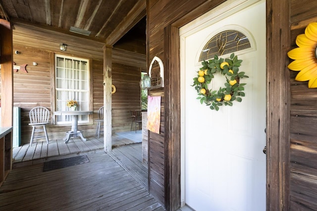doorway to property featuring covered porch