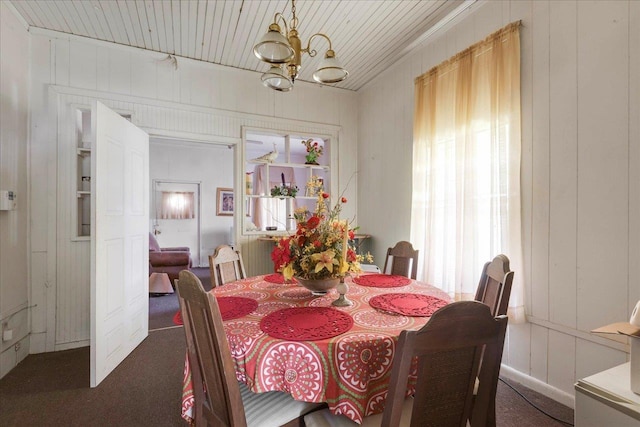143 Washington Ave, Havana, FL 32333 - carpeted dining space featuring a chandelier, healthy amount of natural light, and a decorative wall
