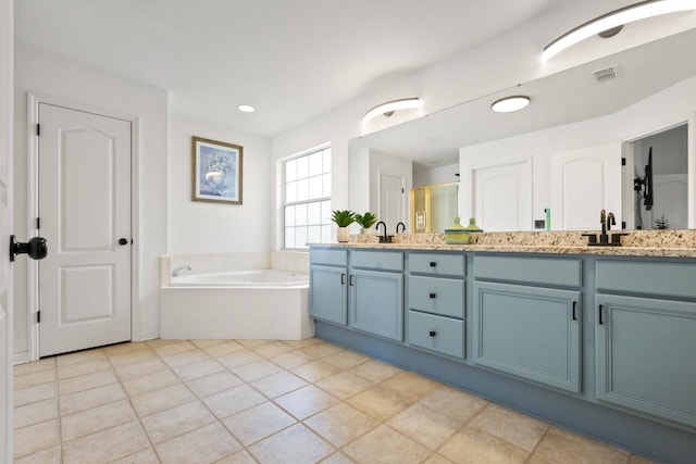 full bathroom featuring double vanity, a garden tub, visible vents, tile patterned floors, and a shower with door