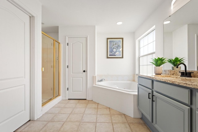 full bath featuring a garden tub, recessed lighting, vanity, and a shower stall