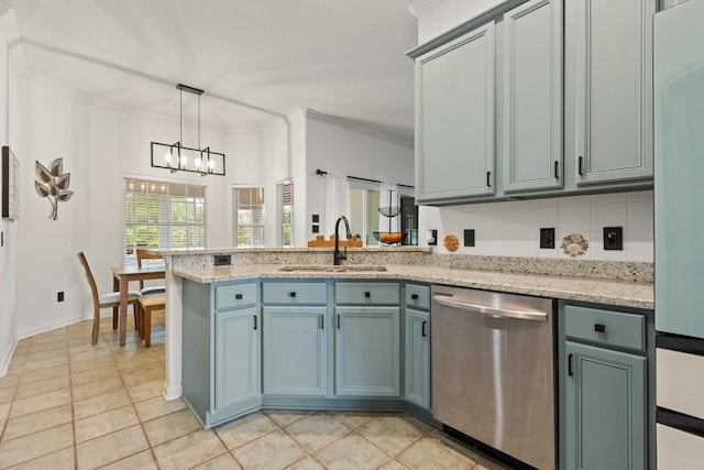 kitchen featuring stainless steel dishwasher, fridge, a sink, a peninsula, and a notable chandelier