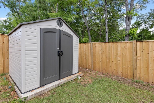 view of shed with a fenced backyard