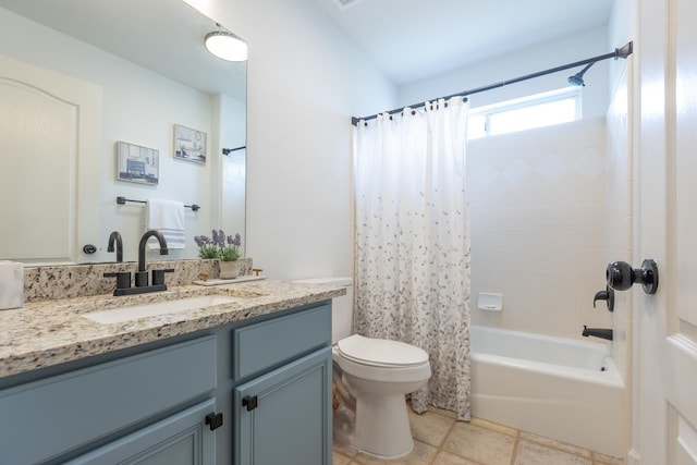 full bathroom with vanity, shower / bath combo, and toilet