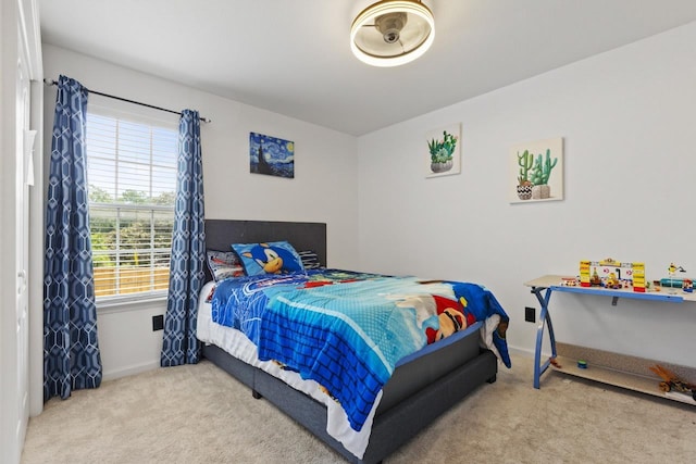 carpeted bedroom with baseboards