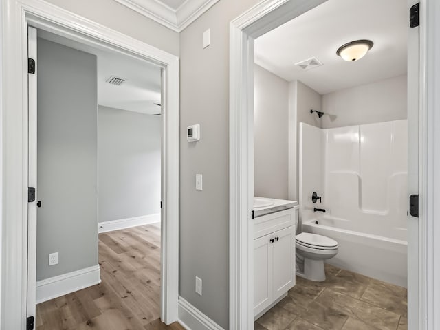 65 Sioux Trl, Crawfordville, FL 32327 - bathroom with toilet, vanity, baseboards, shower / bath combination, and ornamental molding