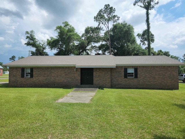 ranch-style home with a front lawn