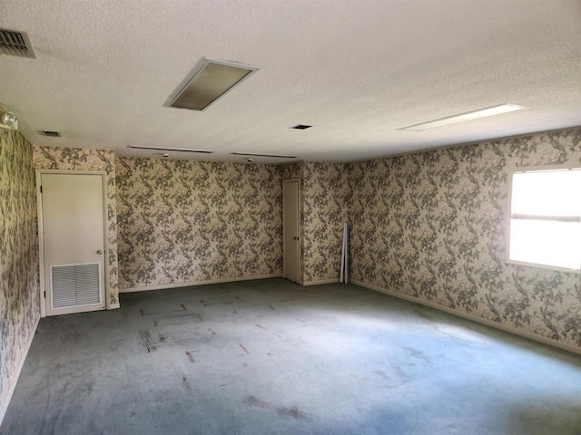 spare room featuring a textured ceiling