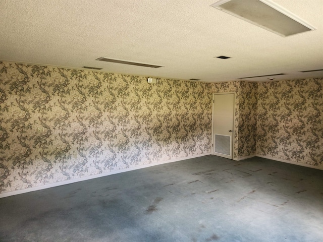 spare room featuring a textured ceiling