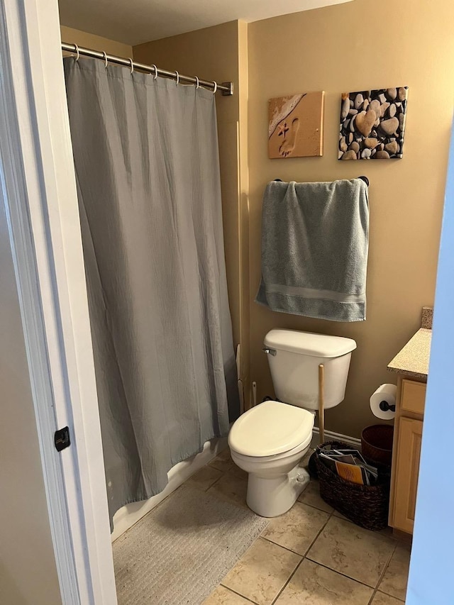 215 W College Ave Unit 511, Tallahassee, FL 32301 - bathroom with vanity, curtained shower, toilet, and tile patterned floors