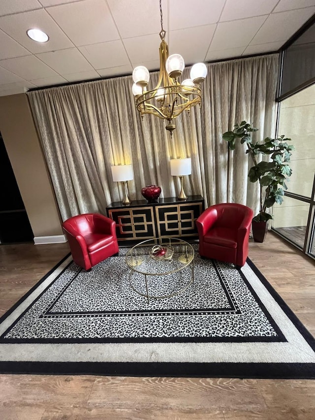 215 W College Ave Unit 511, Tallahassee, FL 32301 - sitting room with wood finished floors and a chandelier