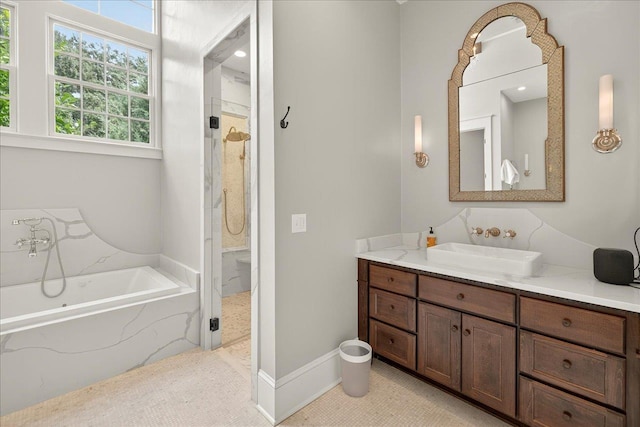 4640 Grove Park Dr, Tallahassee, FL 32311 - bathroom featuring vanity, a garden tub, and walk in shower