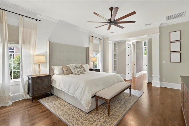 4640 Grove Park Dr, Tallahassee, FL 32311 - bedroom featuring ornamental molding, multiple windows, dark wood-style flooring, and ornate columns